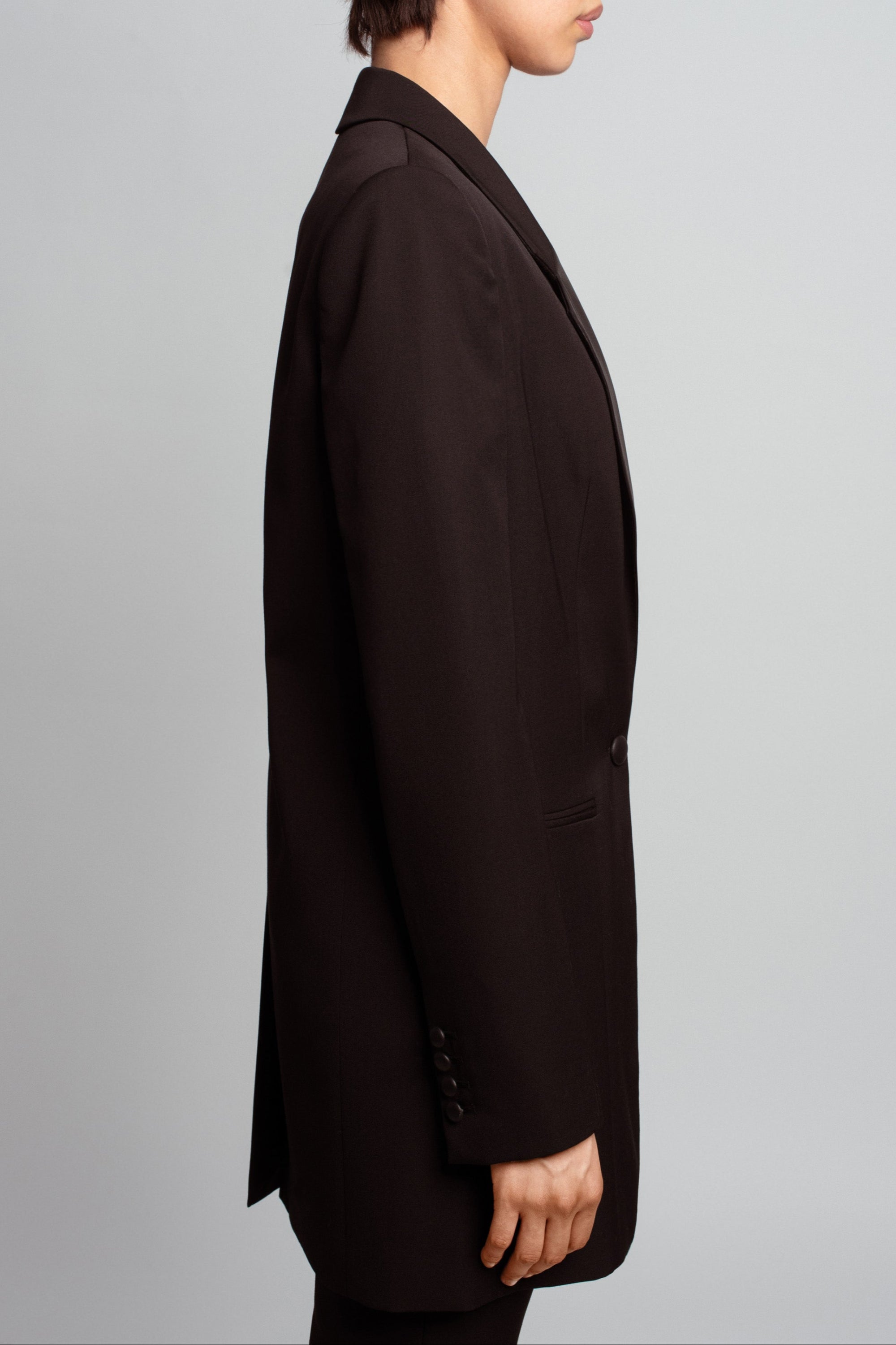 SHAO jet black wool long jacket with structured proportions angled back view