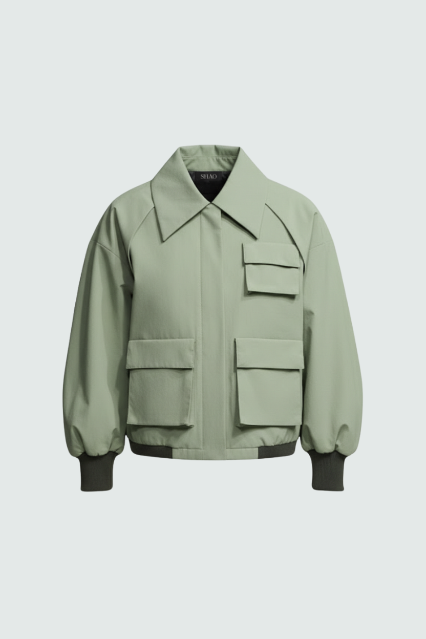 Sage green utility bomber jacket styled with tailored trousers