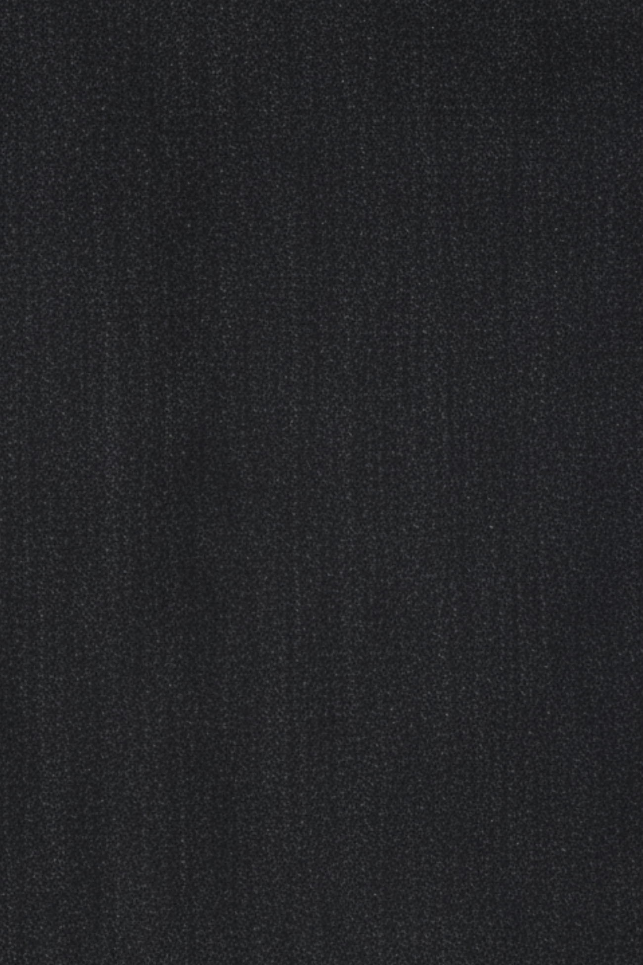 Close-up swatch of black contrast-stitch denim fabric used for the romper