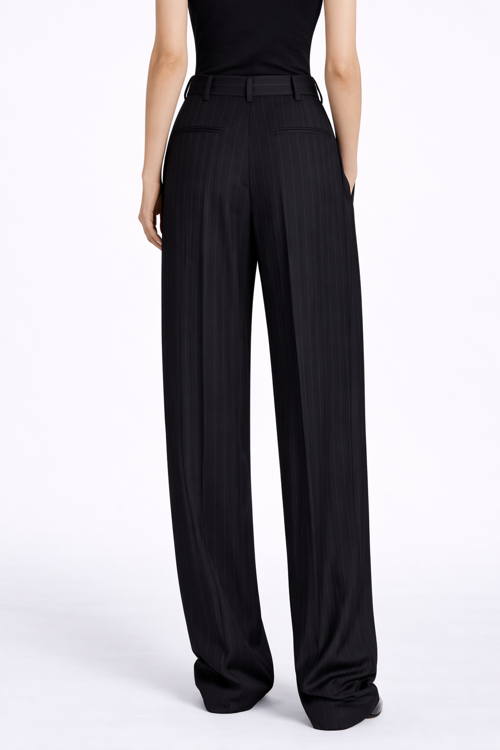 Black wide-leg pants worn by a person on a white background