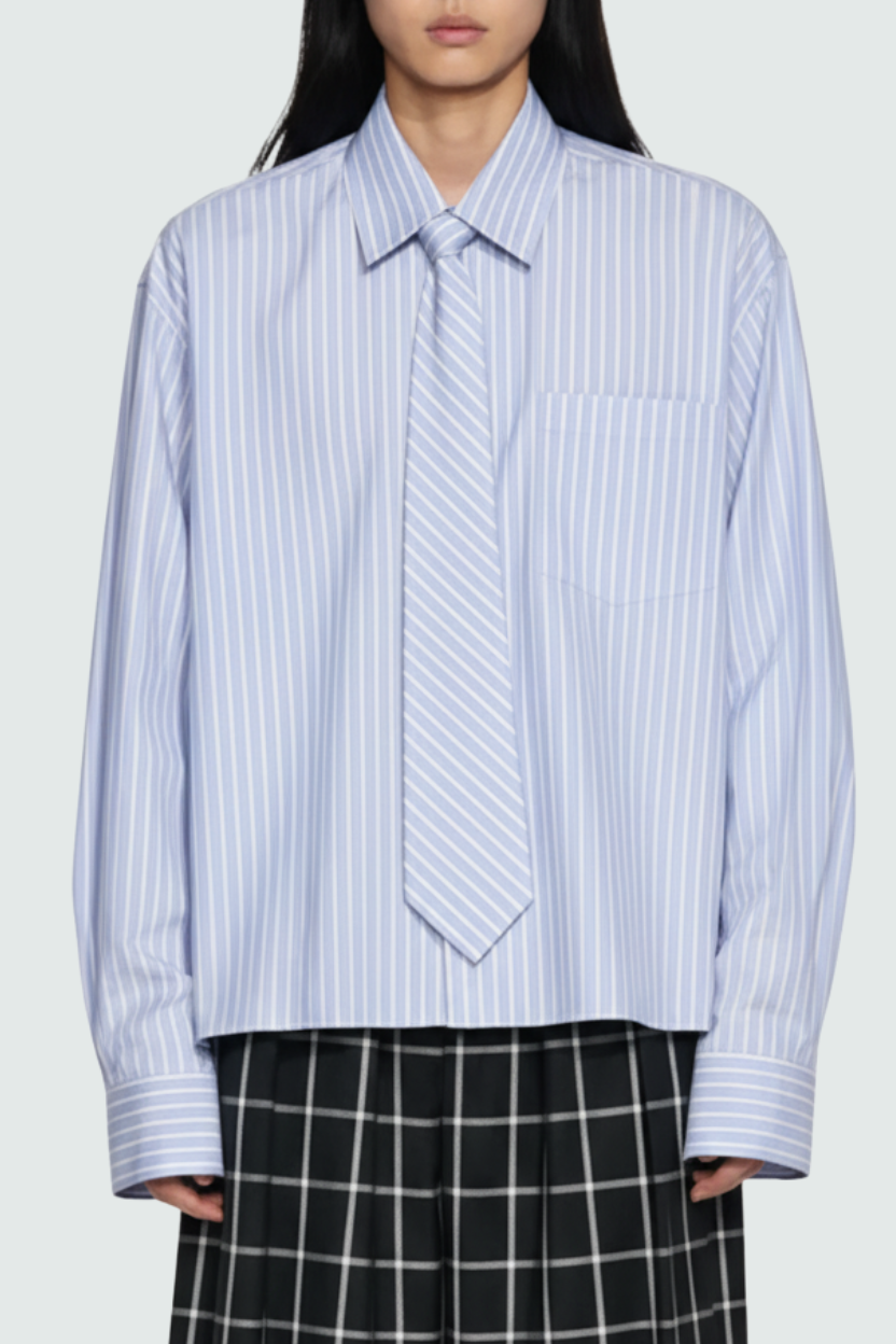 Front view of Blue Striped Structured Collar Shirt featuring vertical stripes, a classic pointed collar, single chest pocket, oversized cuffs, and a relaxed fit in bespoke New York designer tailoring by SHAO New York.