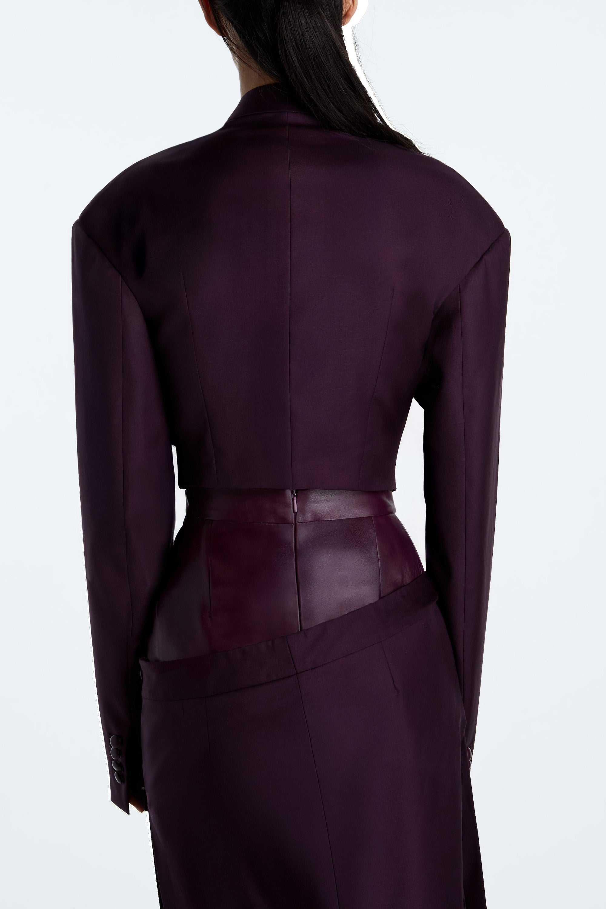 Aubergine Cropped Wool Blazer – back view of tailored cropped blazer with sharp shoulders in rich aubergine wool