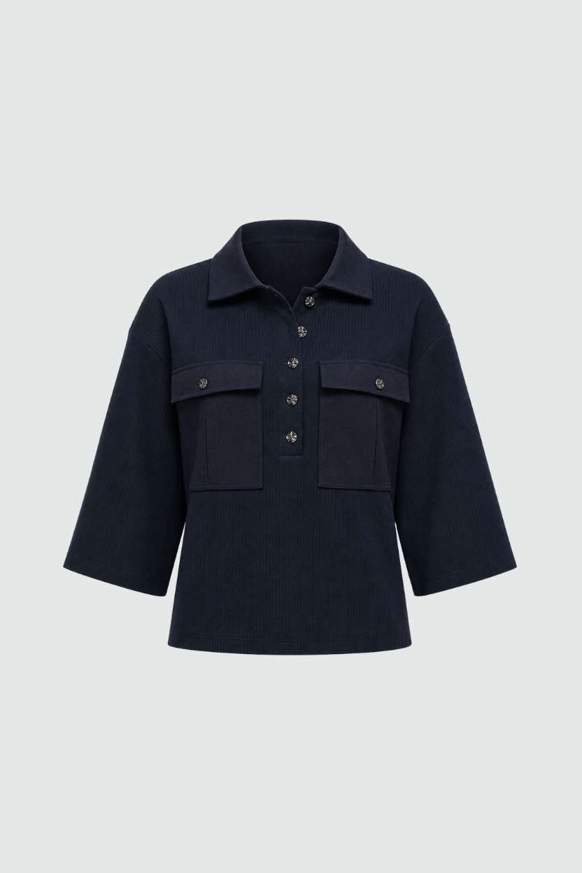 Navy Textured Pocket Polo Top with a relaxed fit, featuring a classic collar, three-quarter sleeves, front flap pockets, and a decorative button placket, embodying luxury designer fashion.