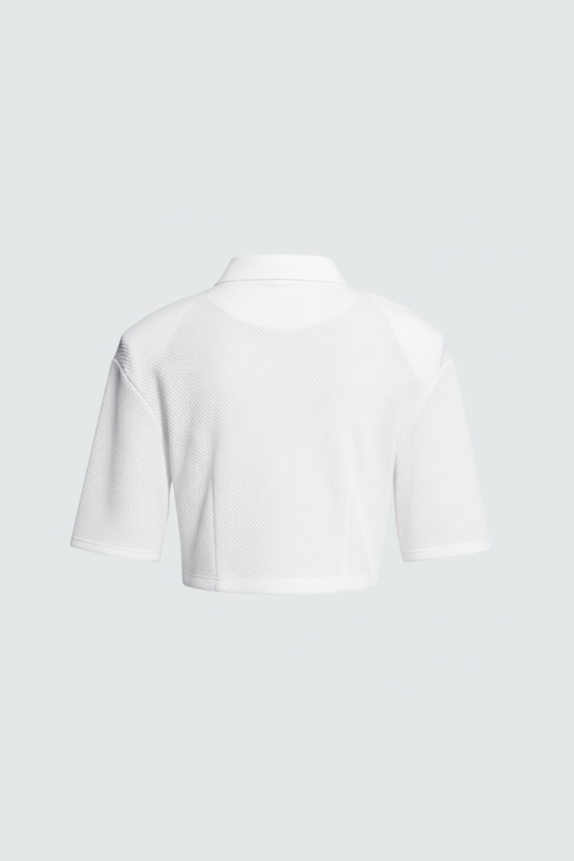 White Textured Cropped Polo Top shown from the back, crafted with breathable textured fabric, featuring a classic collar and short sleeves for a modern tailored look.